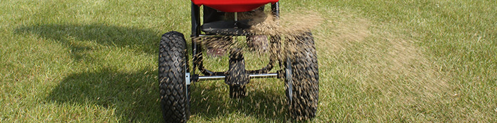Spreading paddock grass seed with a seed spreader - Boston Seeds